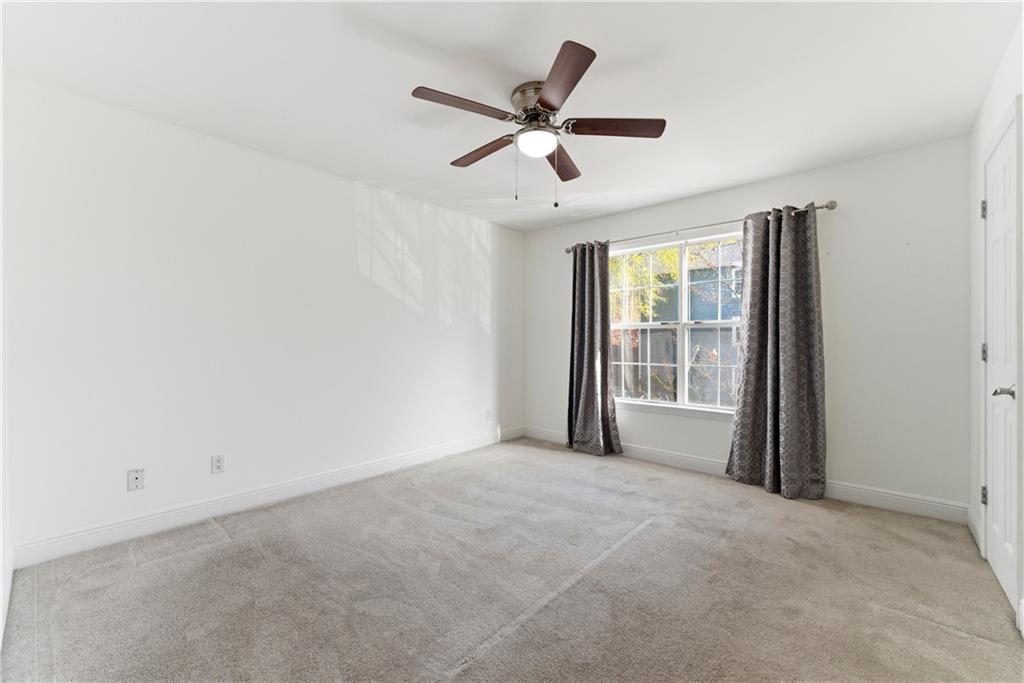5205 Santa Fe Parkway Sandy Springs, GA 30350 - Photo 19 of 27 a view of a livingroom with a ceiling fan and window