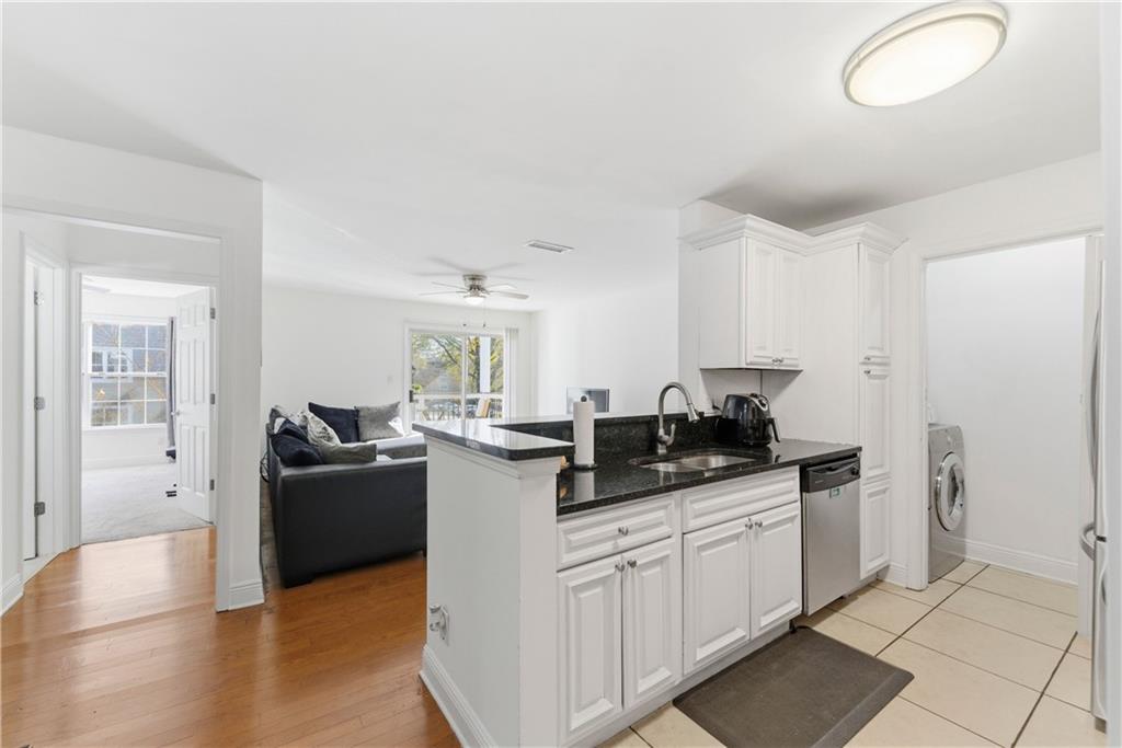5205 Santa Fe Parkway Sandy Springs, GA 30350 - Photo 8 of 27 a kitchen with stainless steel appliances granite countertop a sink and cabinets
