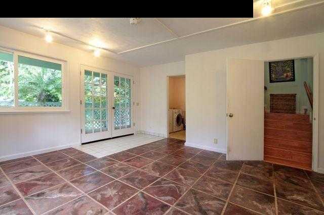 560 West Kuiaha Road Haiku, HI 96708 - Photo 13 of 23 a view of an empty room with a window