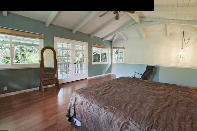 560 West Kuiaha Road Haiku, HI 96708 - Photo 15 of 23 a bedroom with a bed and a large window