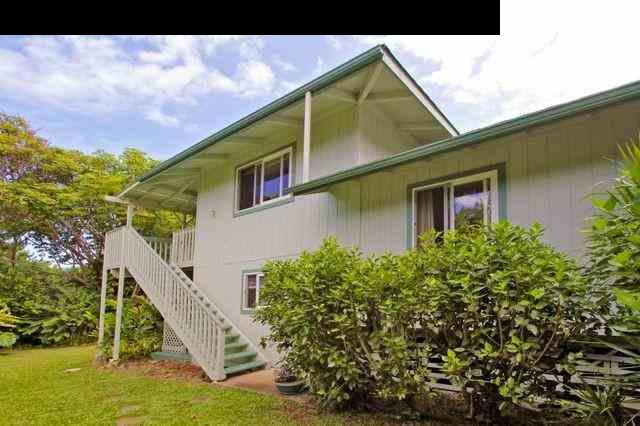 560 West Kuiaha Road Haiku, HI 96708 - Photo 3 of 23 a view of a house with a small yard and potted plants