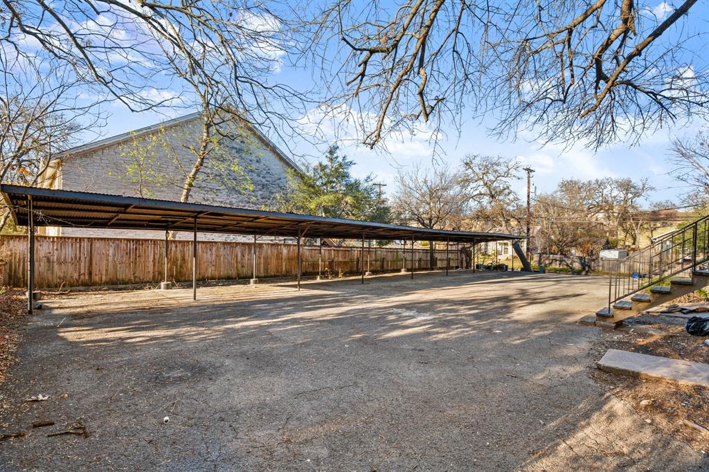301 East 33rd Street, Unit 4 Austin, TX 78705 - Photo 10 of 10 View of car parking with a carport