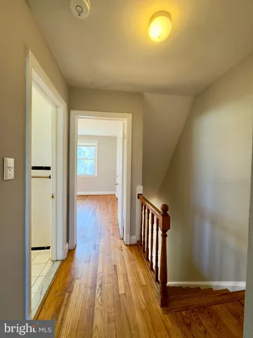 a view of an empty room and wooden floor