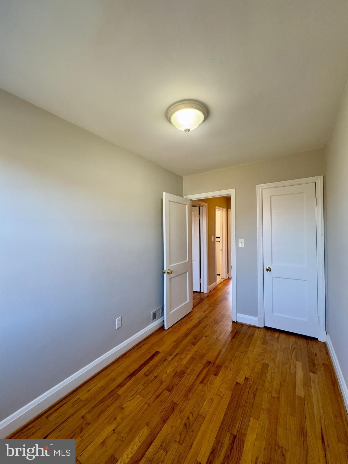 3710 Springwood Avenue Baltimore, MD 21206 - Photo 16 of 24 a view of an empty room and wooden floor