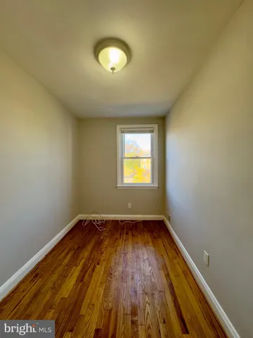 a bathroom with a tub a sink and mirror