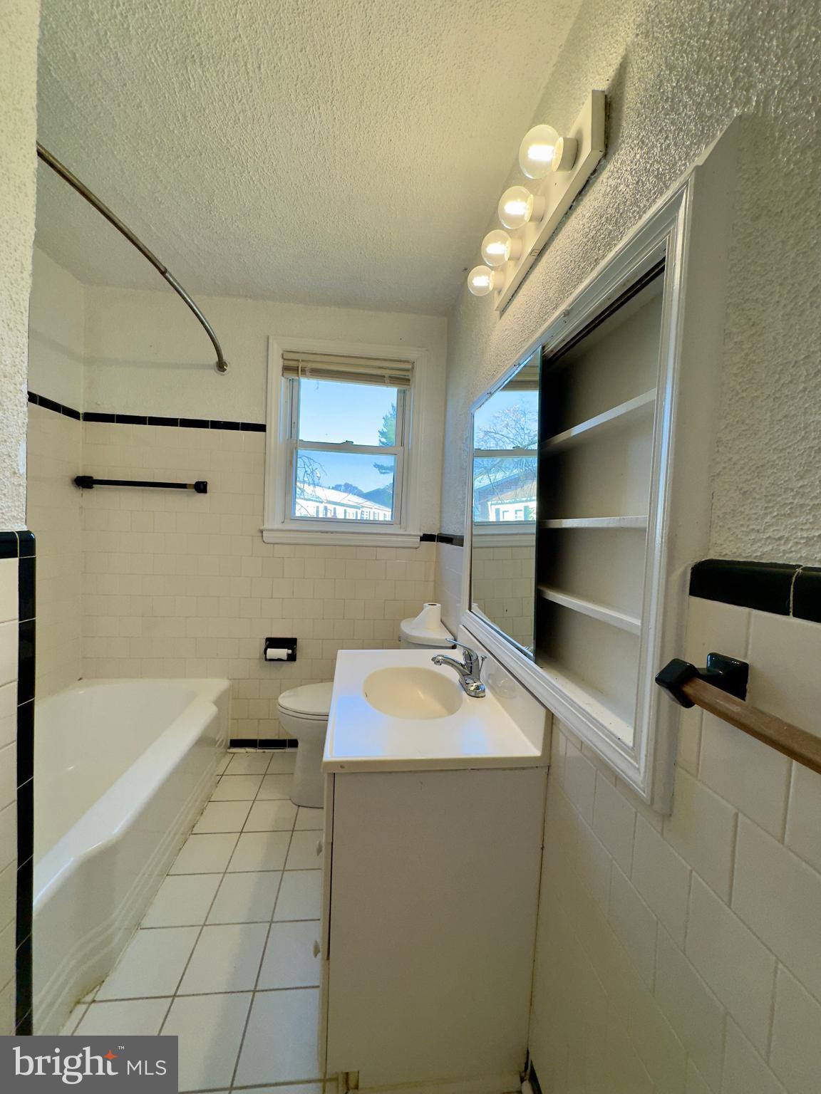 3710 Springwood Avenue Baltimore, MD 21206 - Photo 20 of 24 a bathroom with a sink a toilet and bathtub