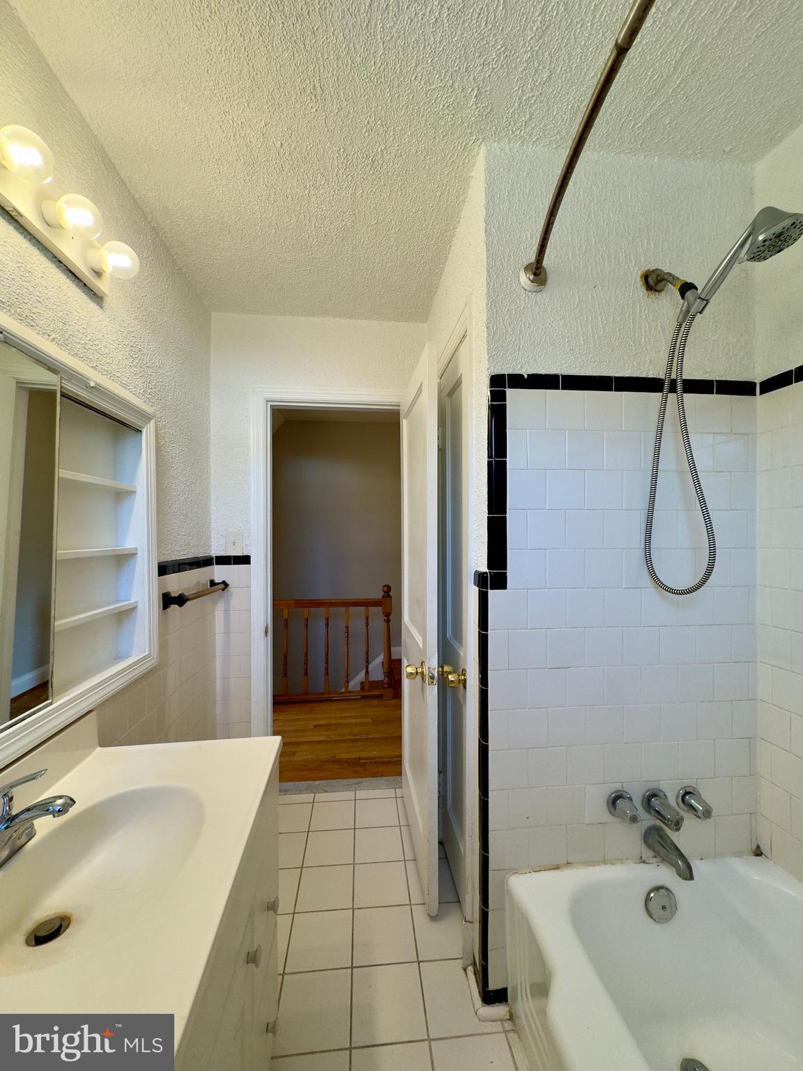 3710 Springwood Avenue Baltimore, MD 21206 - Photo 21 of 24 a bathroom with a tub a sink and mirror