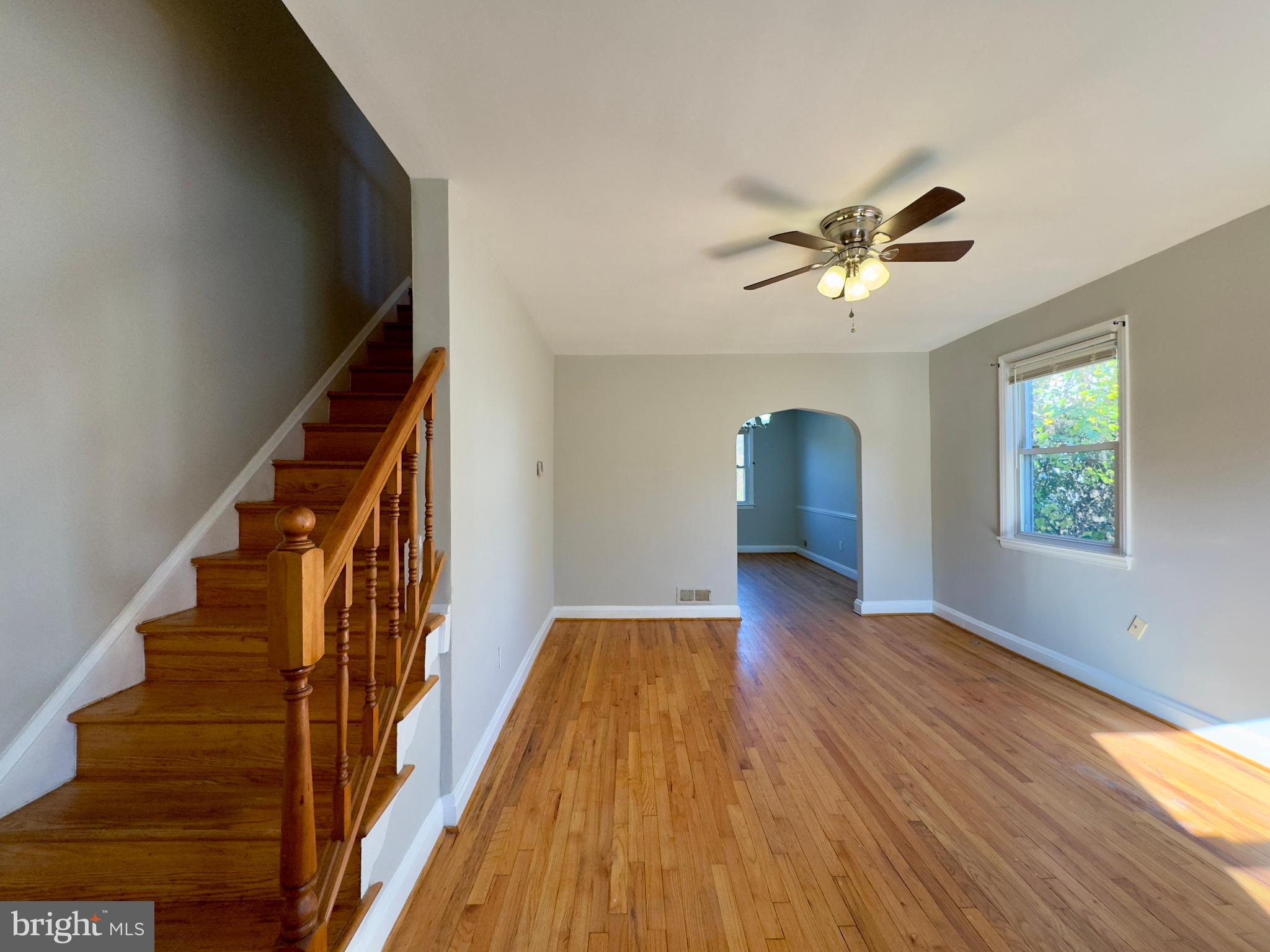 3710 Springwood Avenue Baltimore, MD 21206 - Photo 6 of 24 wooden floor in an empty room with a window