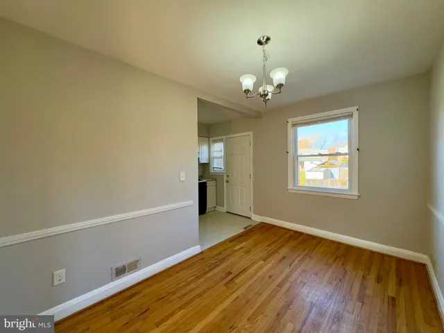 a kitchen with granite countertop a stove sink and cabinets