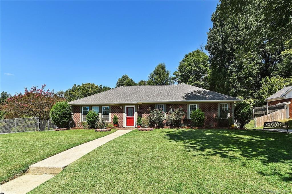 7101 Riding Trail Road, Unit 1 Charlotte, NC 28212 - Photo 1 of 14 a front view of a house with garden