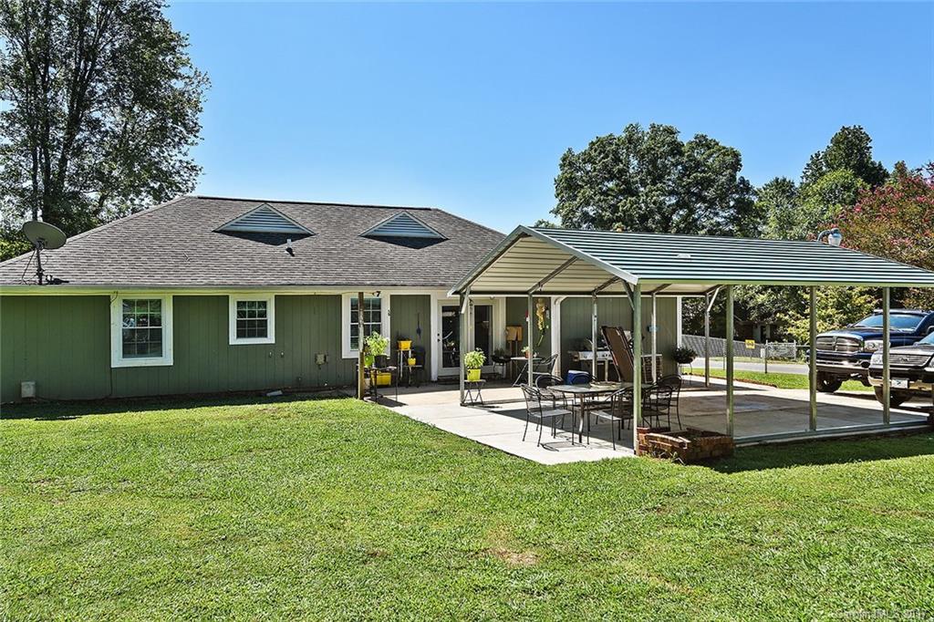 7101 Riding Trail Road, Unit 1 Charlotte, NC 28212 - Photo 13 of 14 a front view of a house with garden