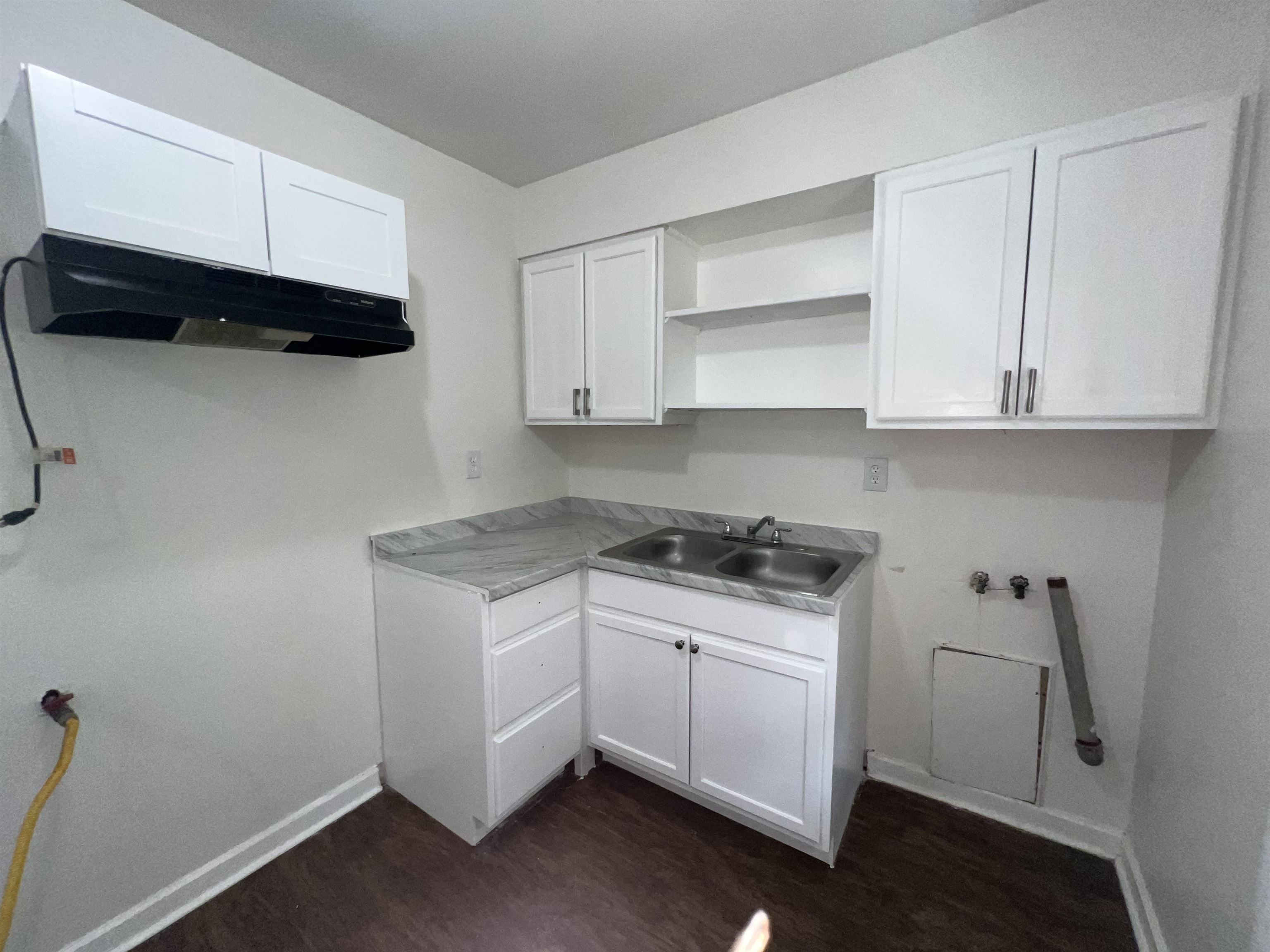 2235 Charjean Road Memphis, TN 38114 - Photo 7 of 15 Washroom with dark wood-style floors, cabinet space, and hookup for a washing machine