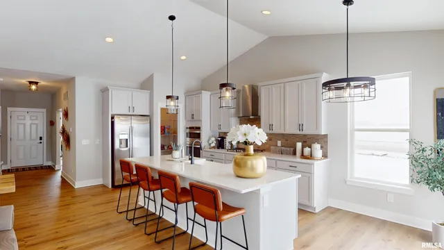 a view of dining room and kitchen with a table chairs