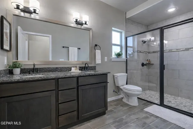 a bathroom with a shower and a toilet