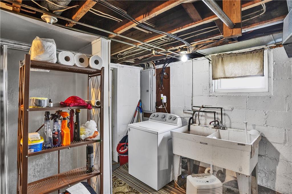 804 George Street Scottdale, PA 15683 - Photo 23 of 34 Basement with utility sink and hook ups. Tenants washer/dryer. "Pittsburgh" shower has not been used. As-is