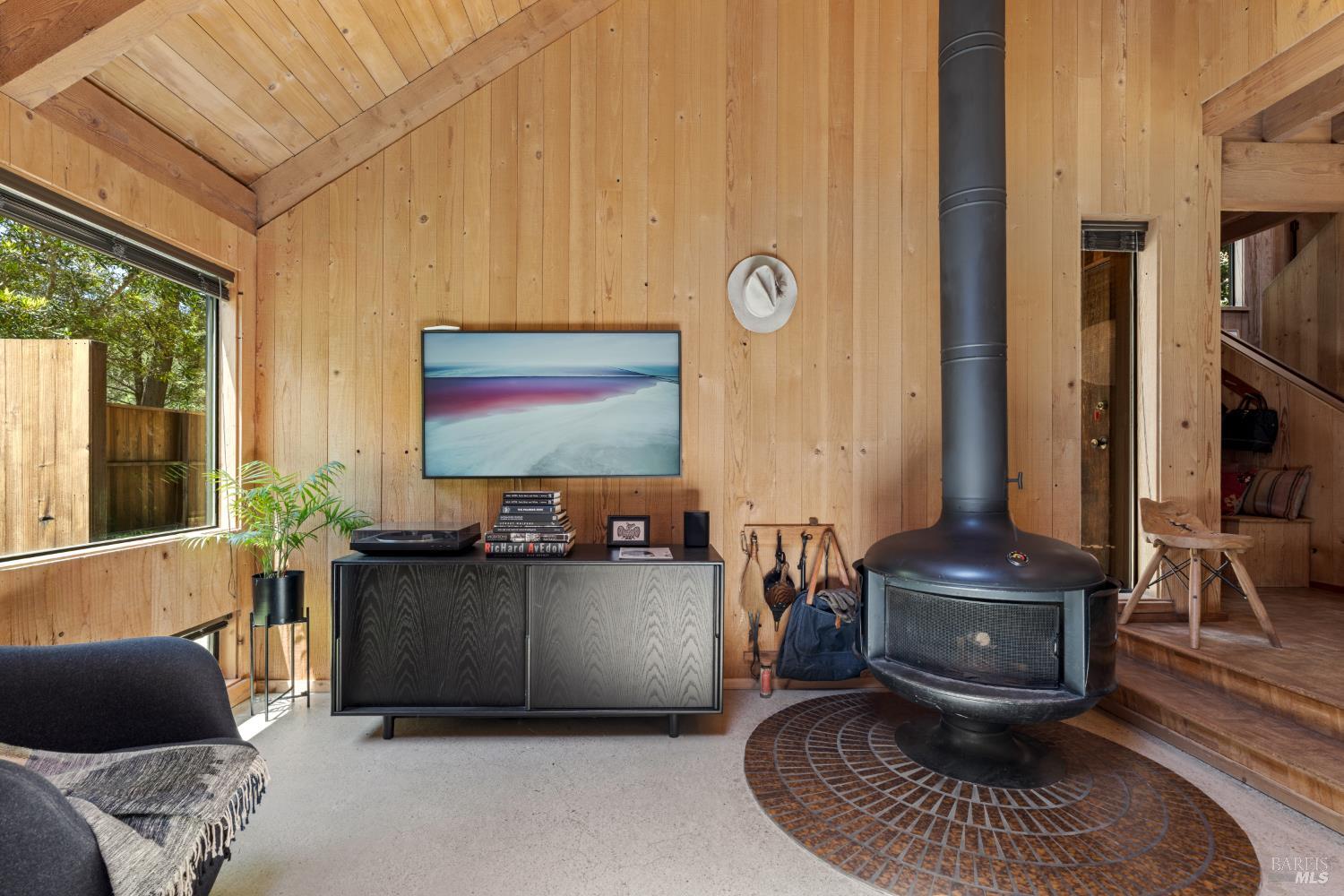 36778 Timber Ridge Road The Sea Ranch, CA 95497 - Photo 21 of 44 a living room with couches and a flat screen tv