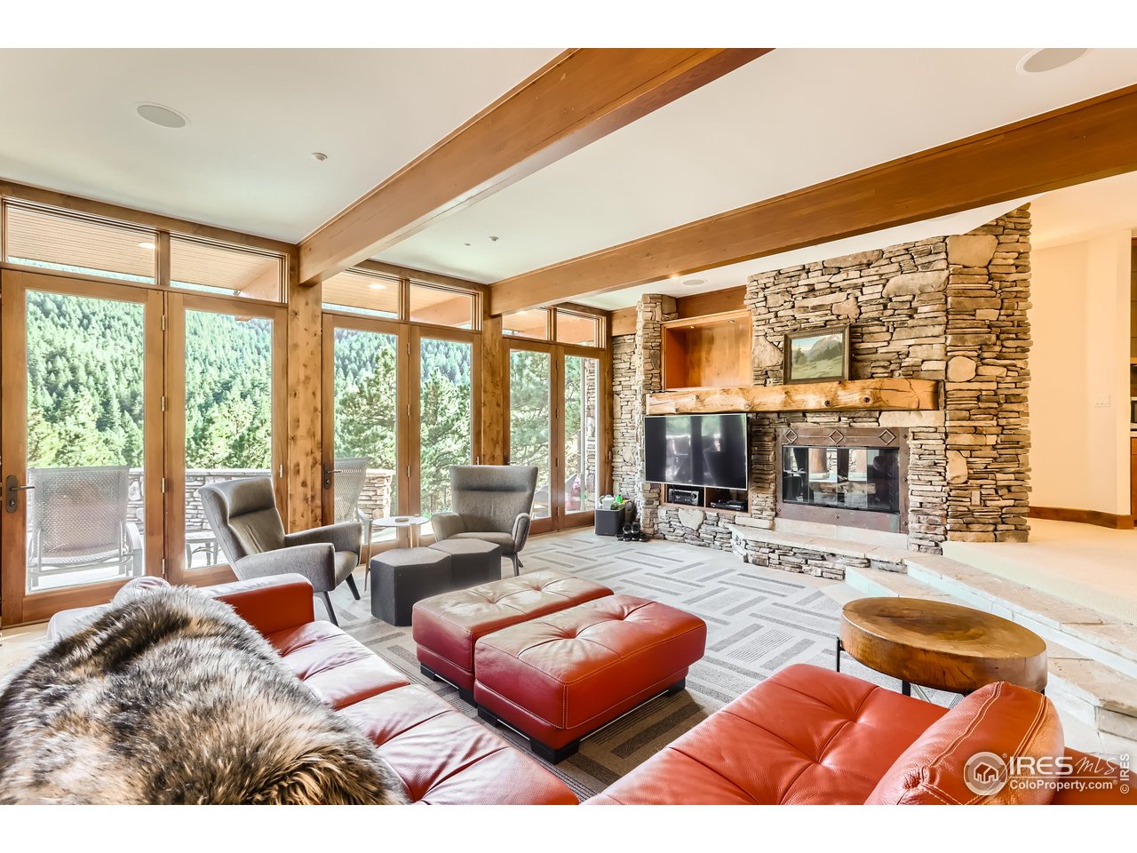 2307 Magnolia Road Nederland, CO 80466 - Photo 18 of 40 a living room with furniture and large windows