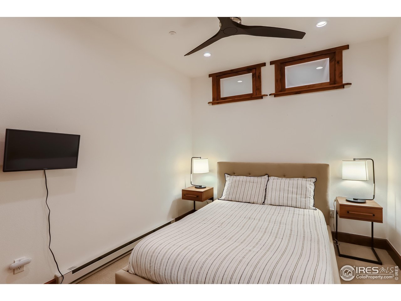 2307 Magnolia Road Nederland, CO 80466 - Photo 23 of 40 a bedroom with a bed and a night stand