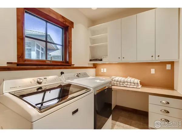 a view of a chairs and table in patio