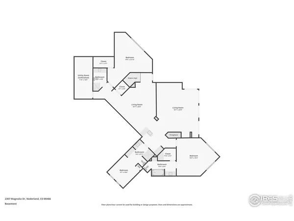 a aerial view of a house with yard and trees in the background