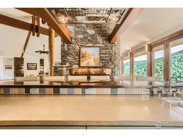 a kitchen with a sink a stove and cabinets