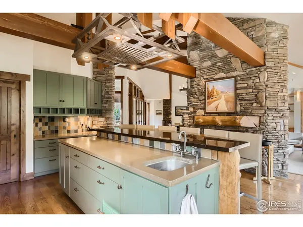 a large kitchen with a table and chairs