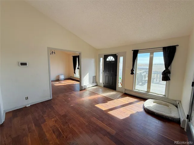 a view of livingroom with furniture and wooden floor