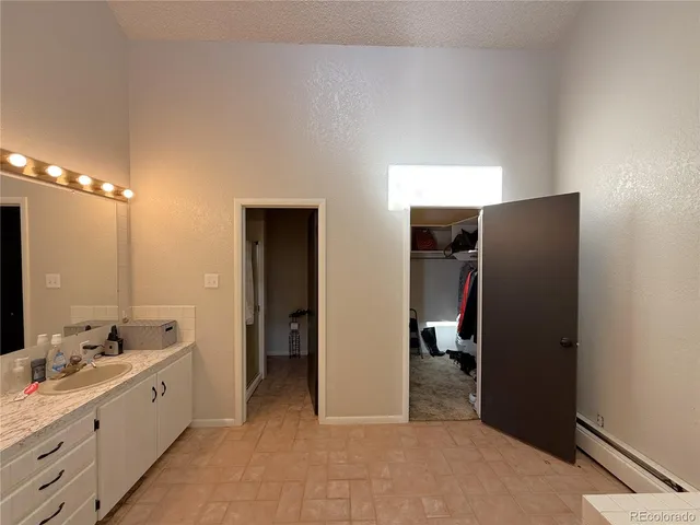 a bathroom with a double vanity sink and mirror
