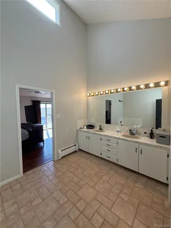 a large white room with cabinets