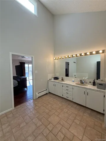 a large white room with cabinets