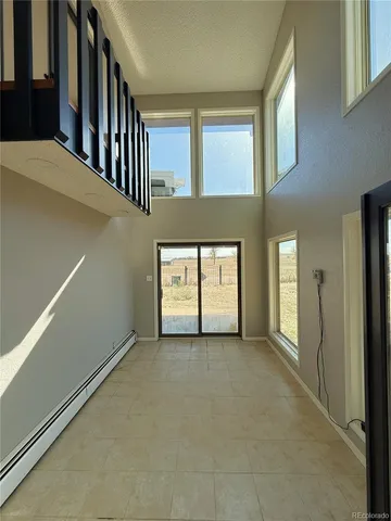 a view of a room with large windows