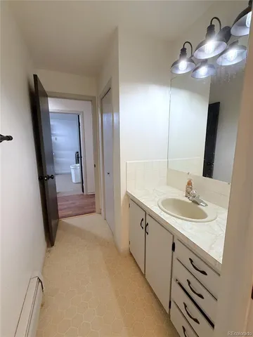 a bathroom with a sink a vanity and a mirror