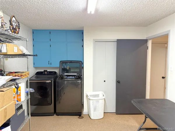 a kitchen with a stove and a refrigerator