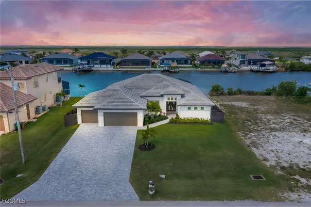 an aerial view of a house with big yard