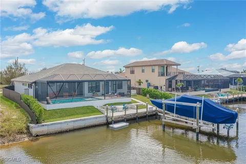 a house with swimming pool in front of it