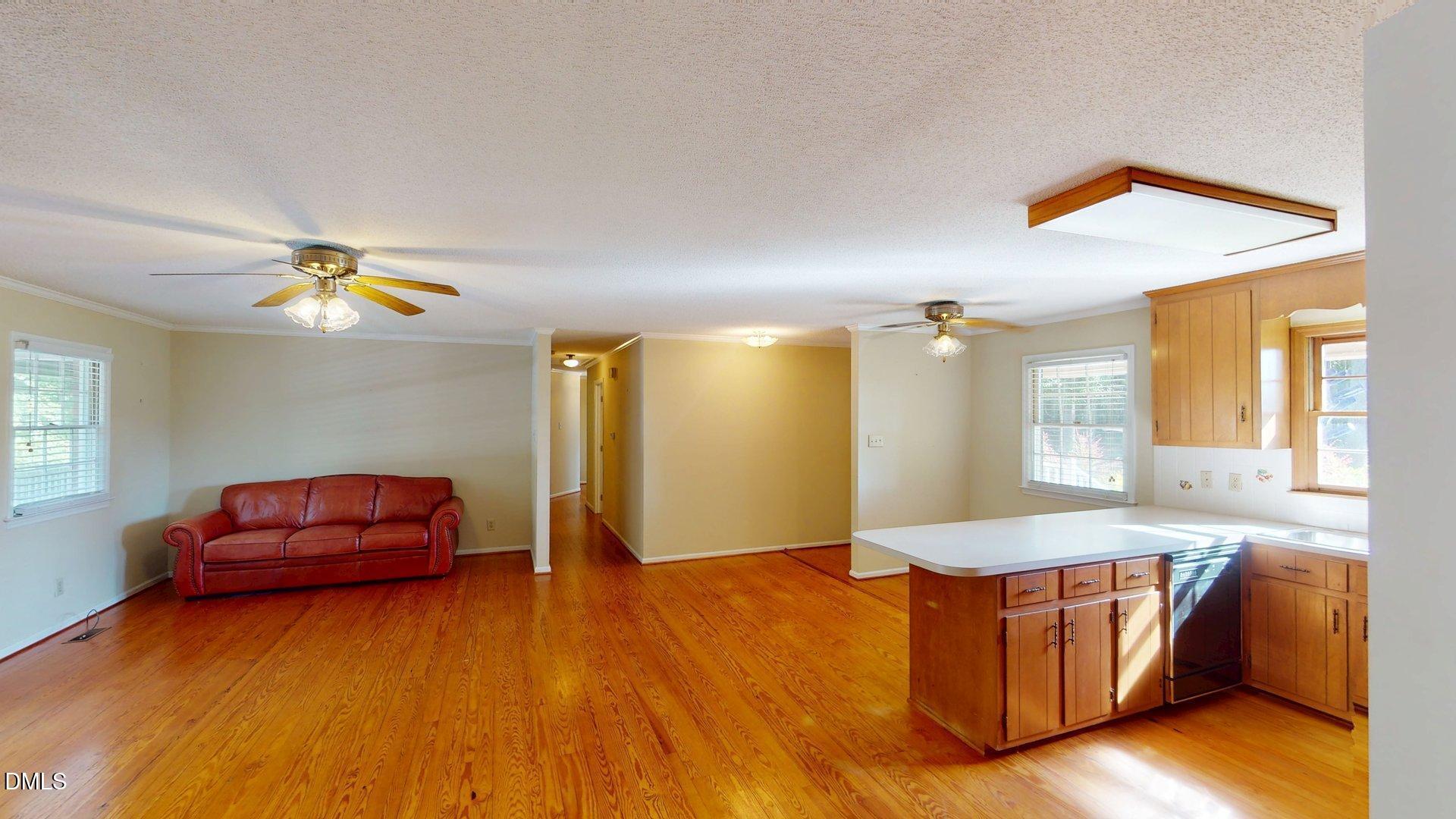 2805 Redwood Road Durham, NC 27704 - Photo 11 of 26 a living room with furniture and a wooden floor
