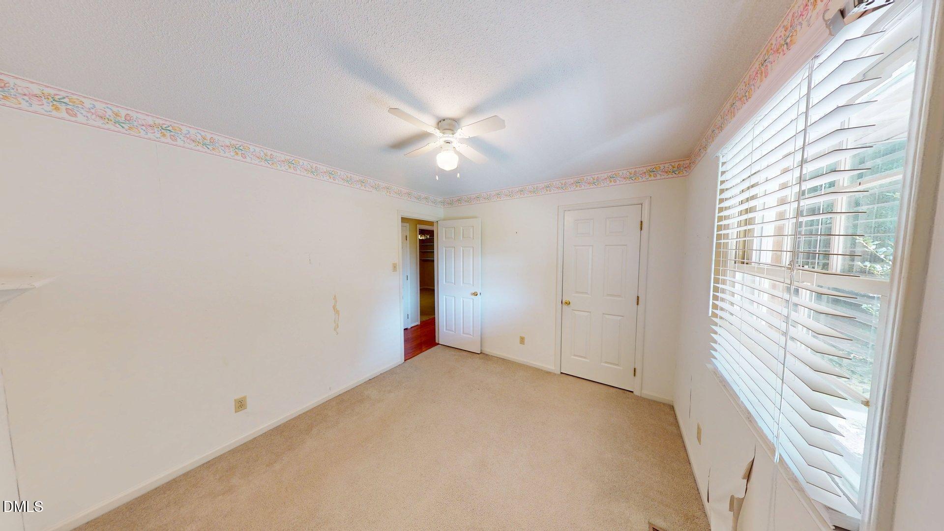 2805 Redwood Road Durham, NC 27704 - Photo 17 of 26 a view of an empty room with a window