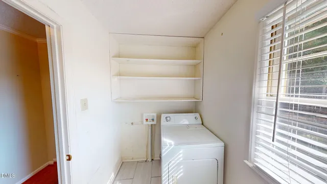 a view of a hallway with bathroom