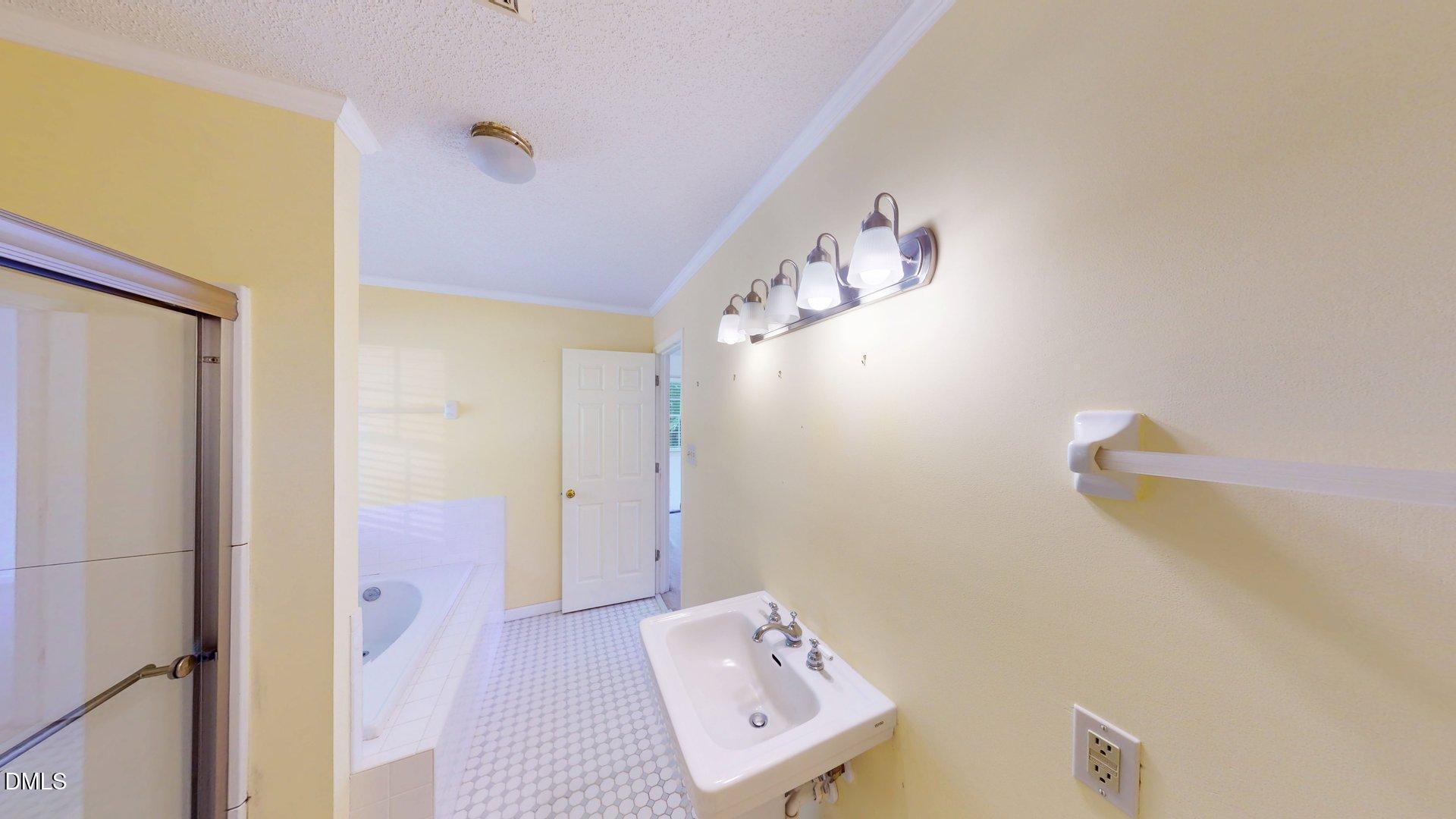 2805 Redwood Road Durham, NC 27704 - Photo 23 of 26 a bathroom with a bathtub and shower