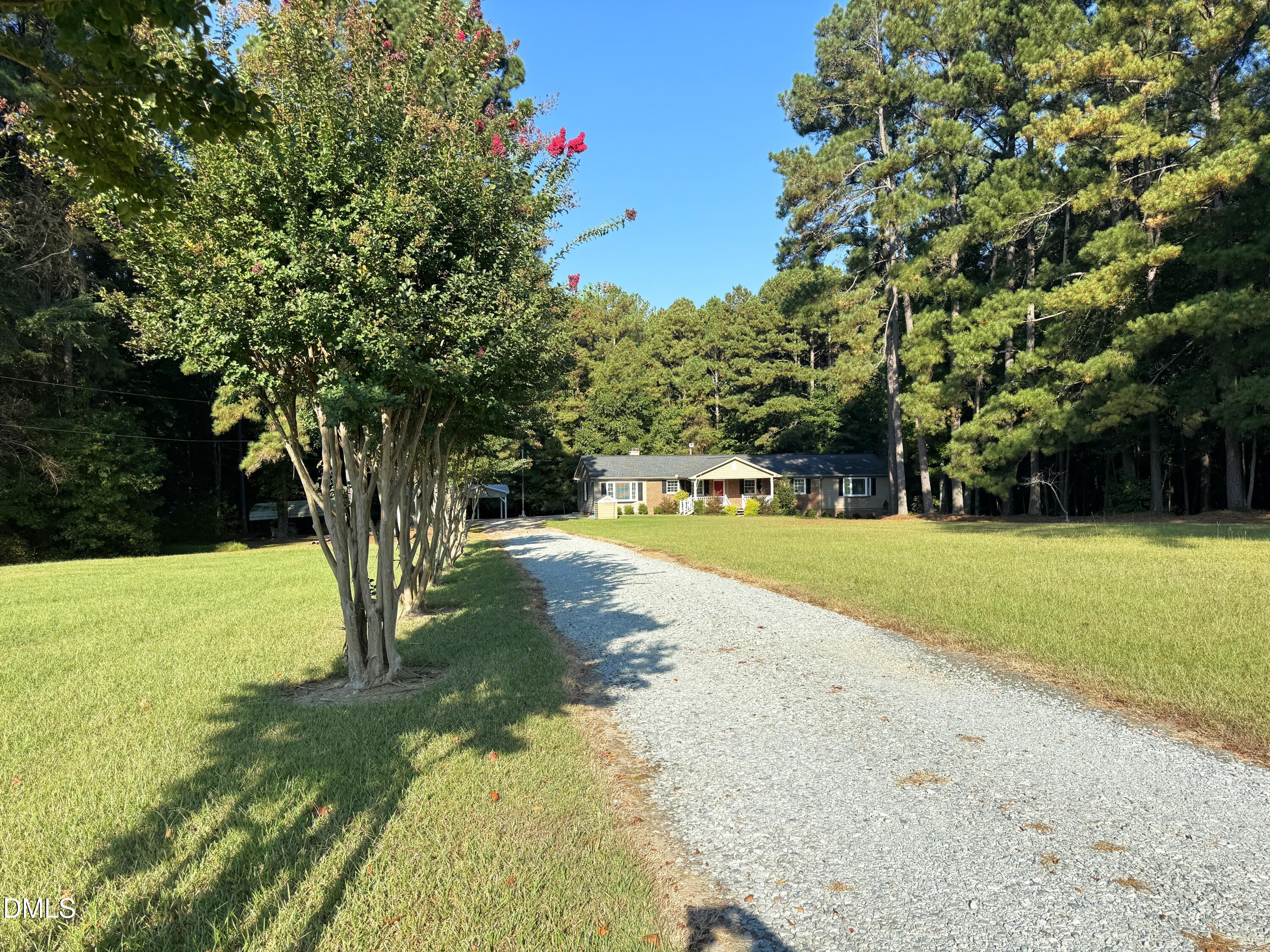 2805 Redwood Road Durham, NC 27704 - Photo 2 of 26 a view of a yard with palm trees