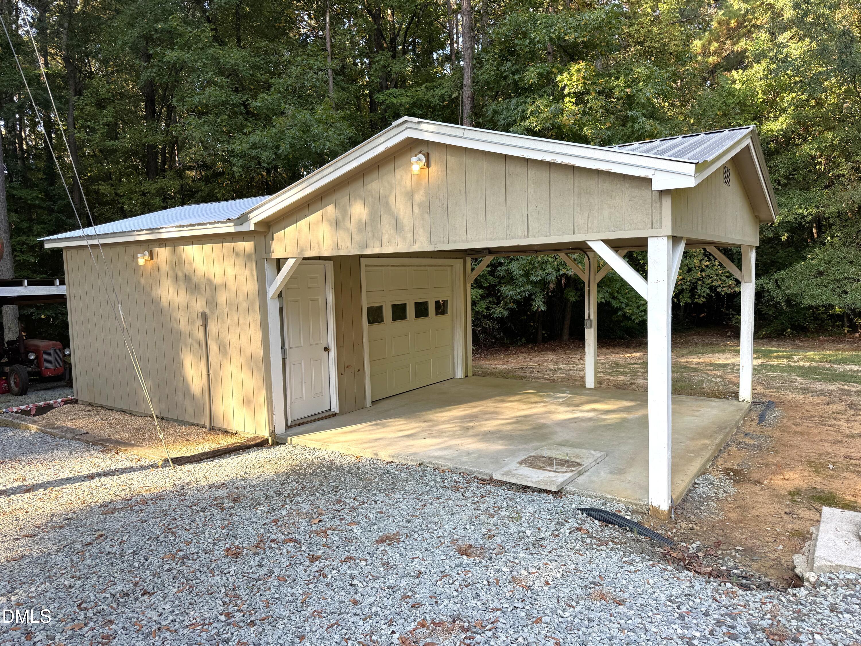 2805 Redwood Road Durham, NC 27704 - Photo 5 of 26 a backyard of a house with yard and outdoor seating