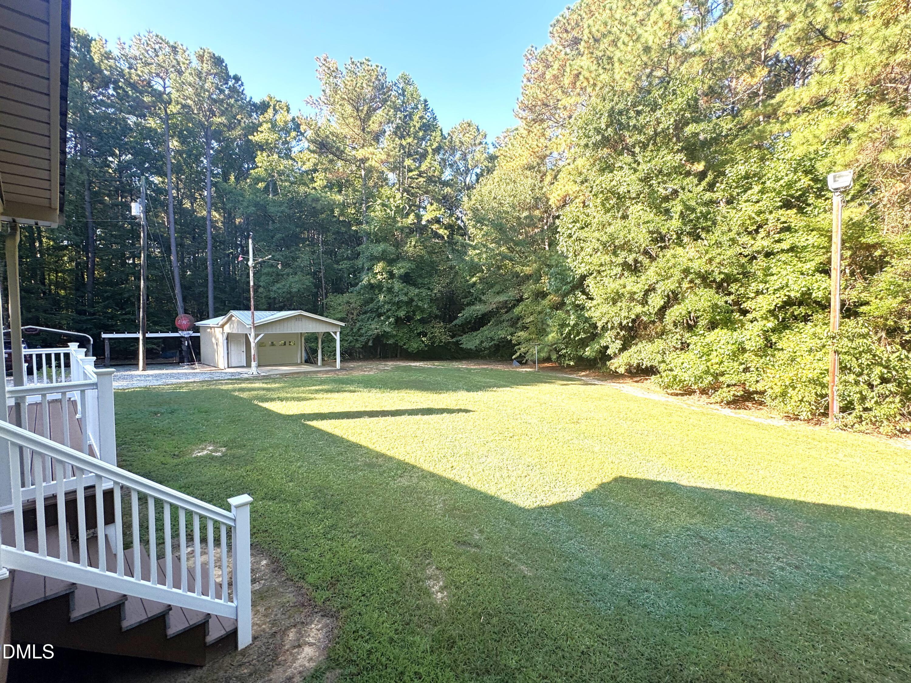 2805 Redwood Road Durham, NC 27704 - Photo 9 of 26 a view of a house with backyard and trees