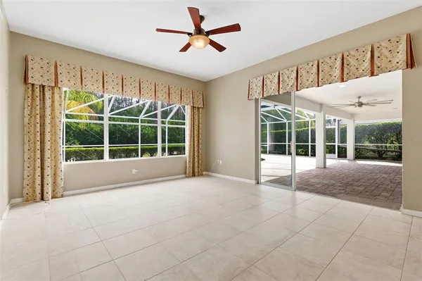 a view of a kitchen with a sink and a refrigerator