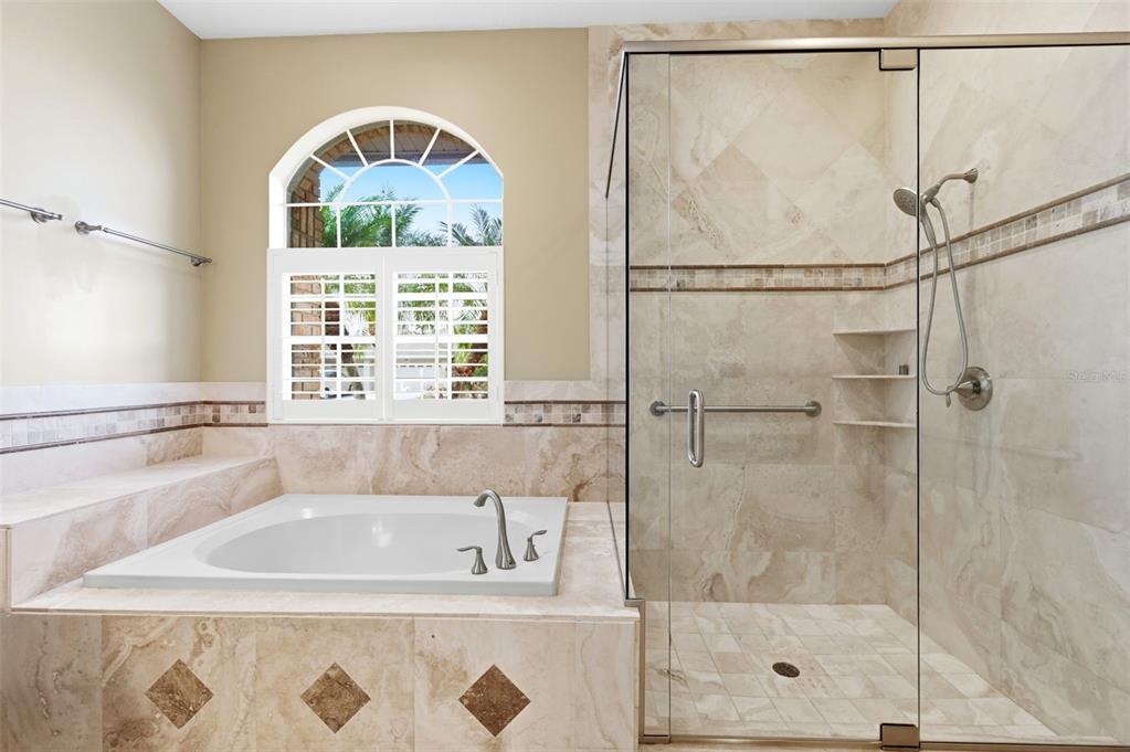 1450 Warrington Way Trinity, FL 34655 - Photo 26 of 62 a bathroom with a bathtub and a shower