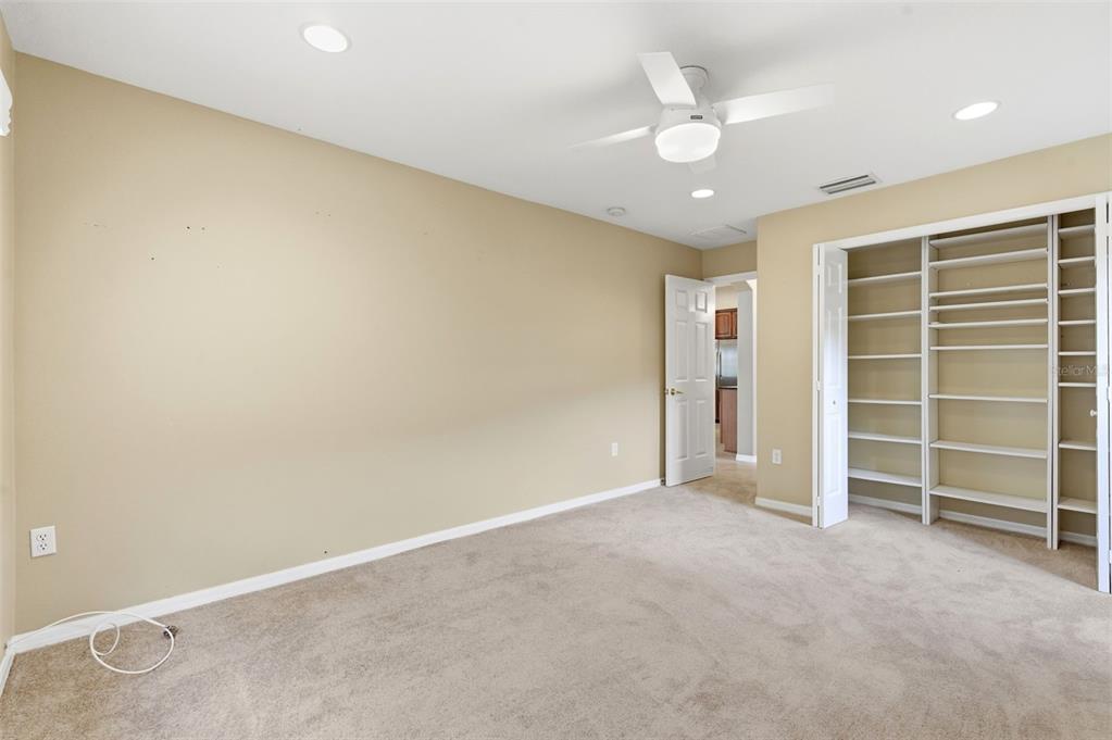1450 Warrington Way Trinity, FL 34655 - Photo 30 of 62 an empty room with a ceiling fan and window
