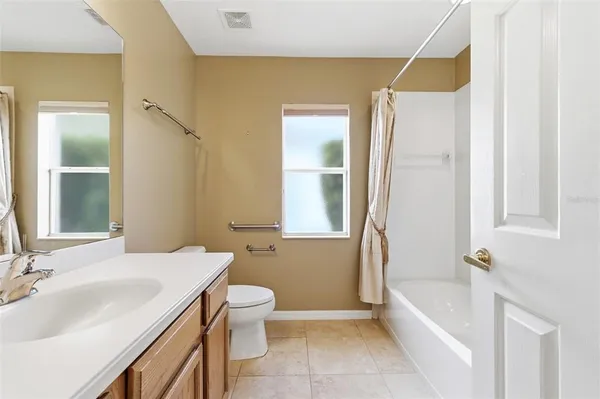a utility room with closet dryer and washer