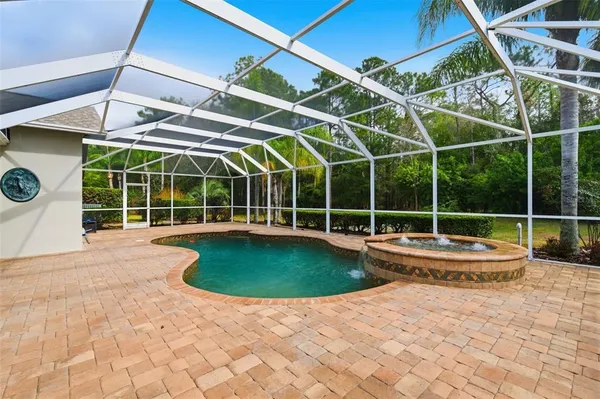 a view of a house with backyard and garden