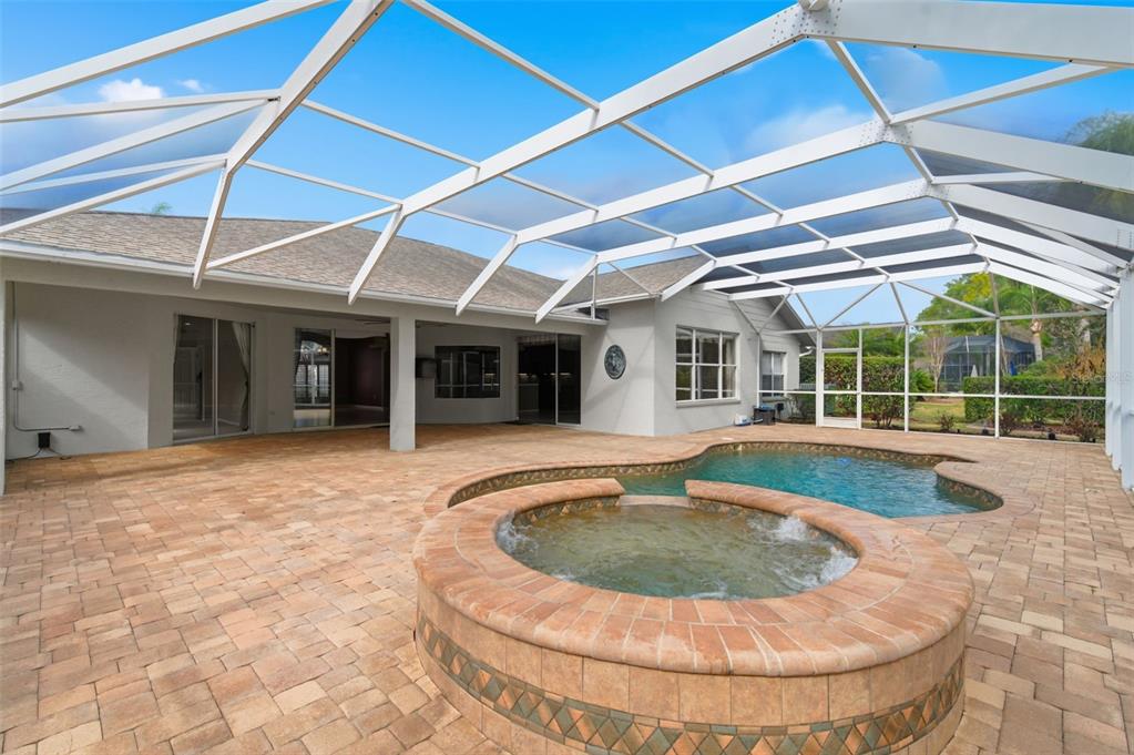 1450 Warrington Way Trinity, FL 34655 - Photo 43 of 62 a view of a house with swimming pool