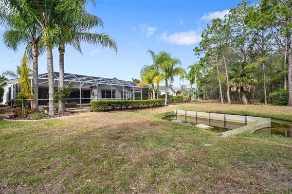 an aerial view of a house with outdoor space