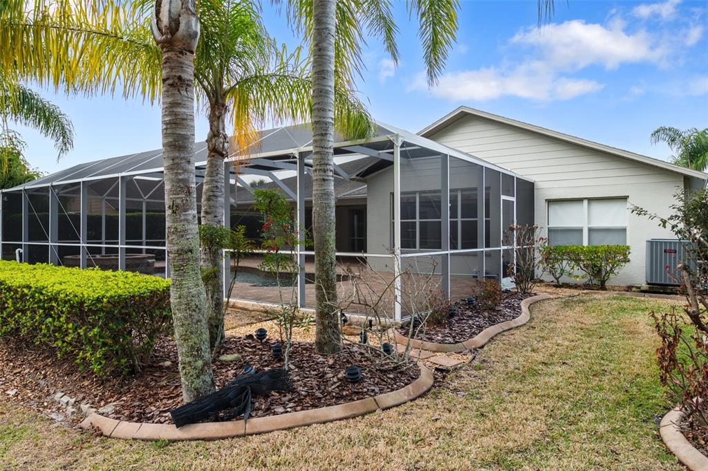 1450 Warrington Way Trinity, FL 34655 - Photo 50 of 62 a view of a house with backyard and garden